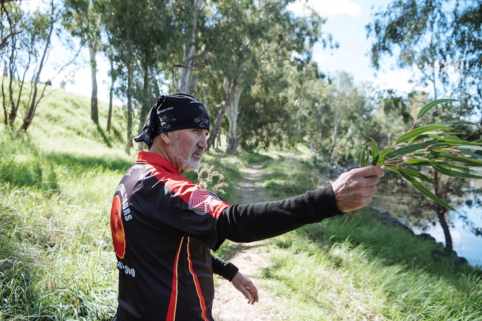 Guide, Mark Sadler on river bank.