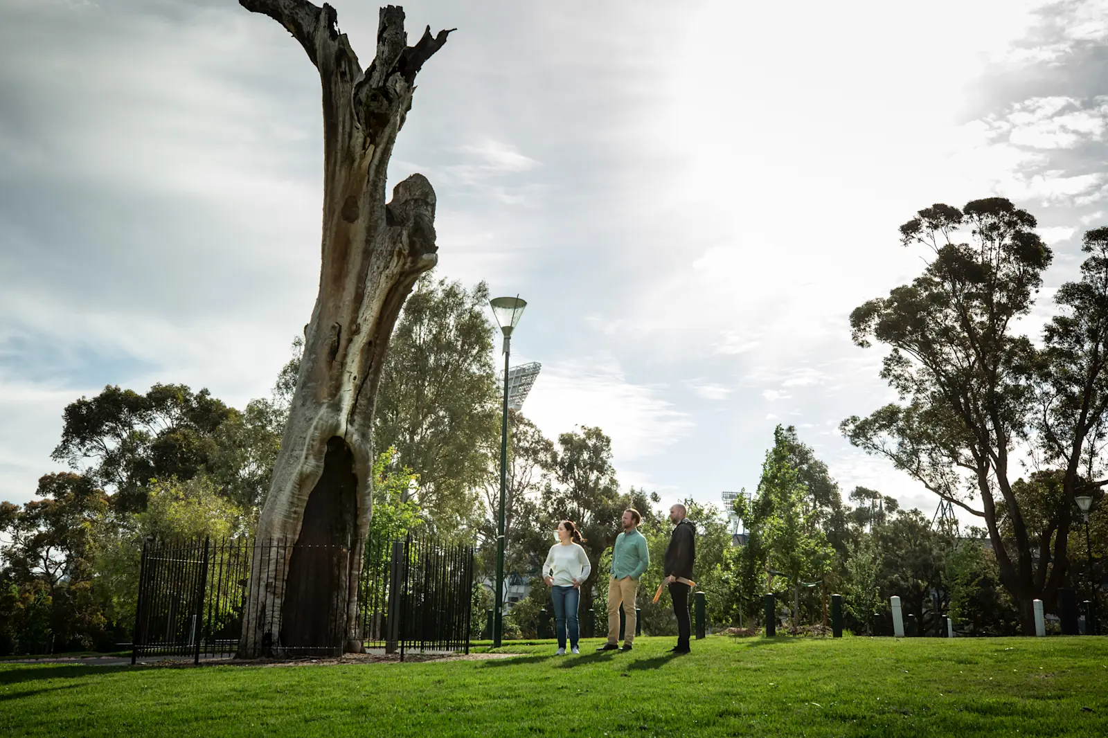 A Koorie Heritage Trust guide taking a couple for a walking tour central Melbourne/Narrm, VIC © Visit Victoria 