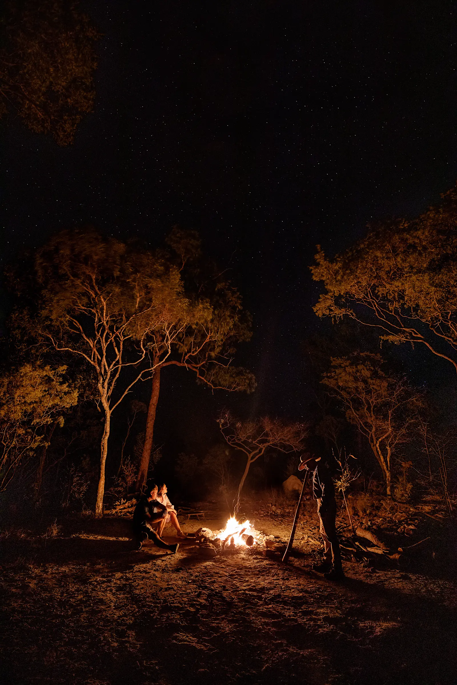 A didgeridoo performance by a campfire on a Jarramali Rock Art Tours overnight tour, QLD © Tourism Tropical North Queensland 

 