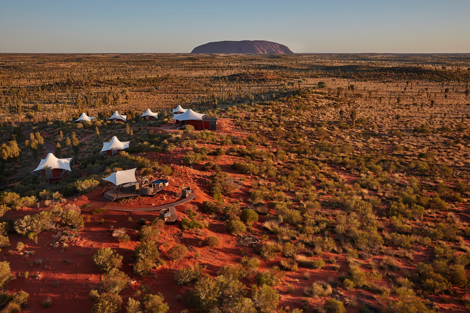 Aerial view of Uluru and Longitude 131 resort in the Northern Territory © Luxury Lodges of Australia