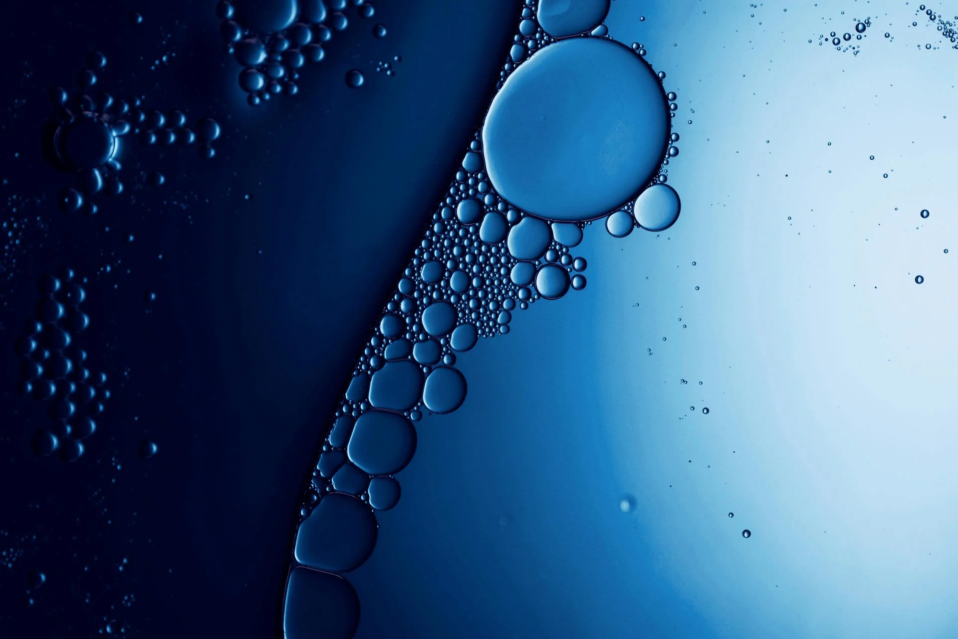 Background with bubbles in green liquid